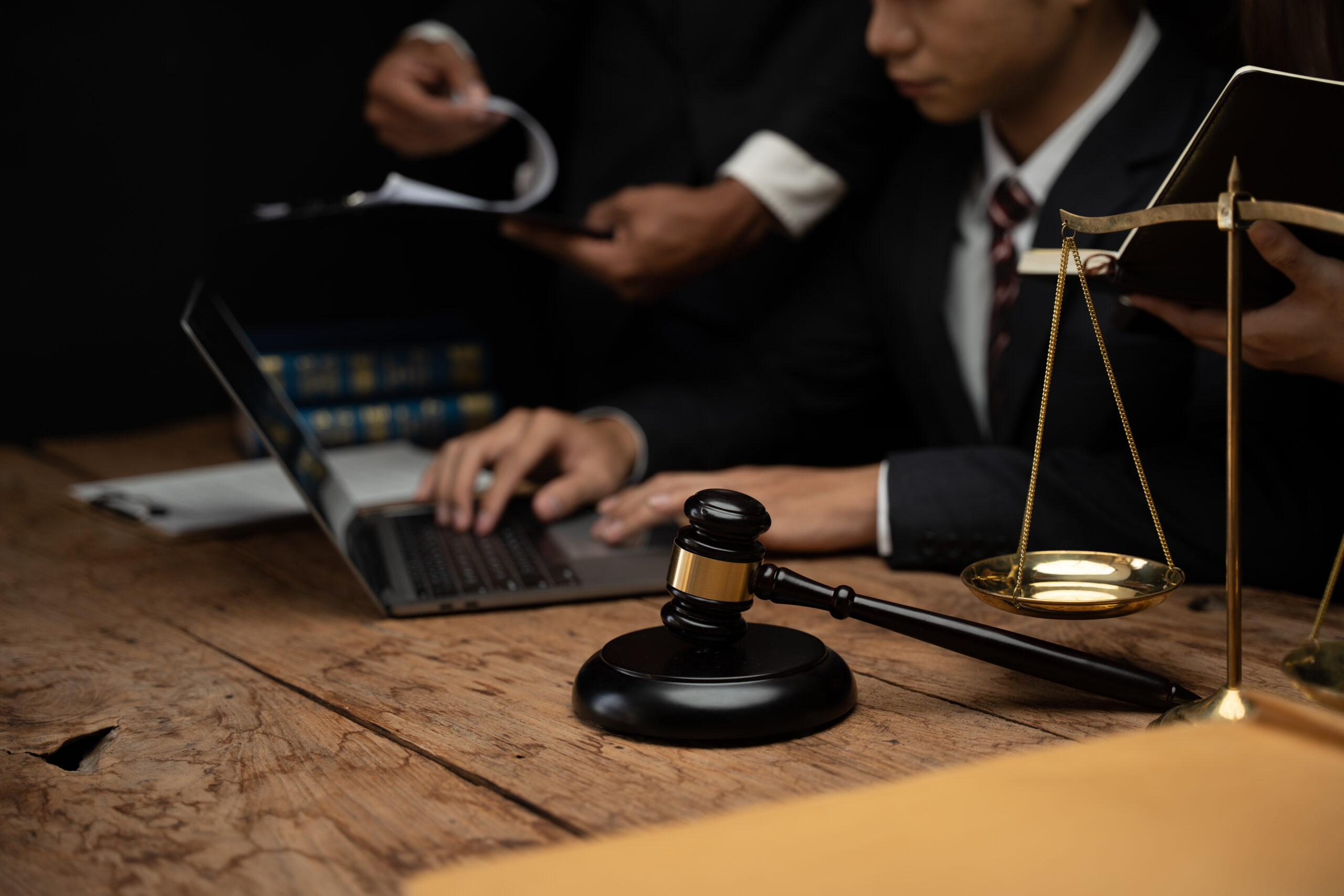 Close up lawyer businessman working or reading lawbook in office