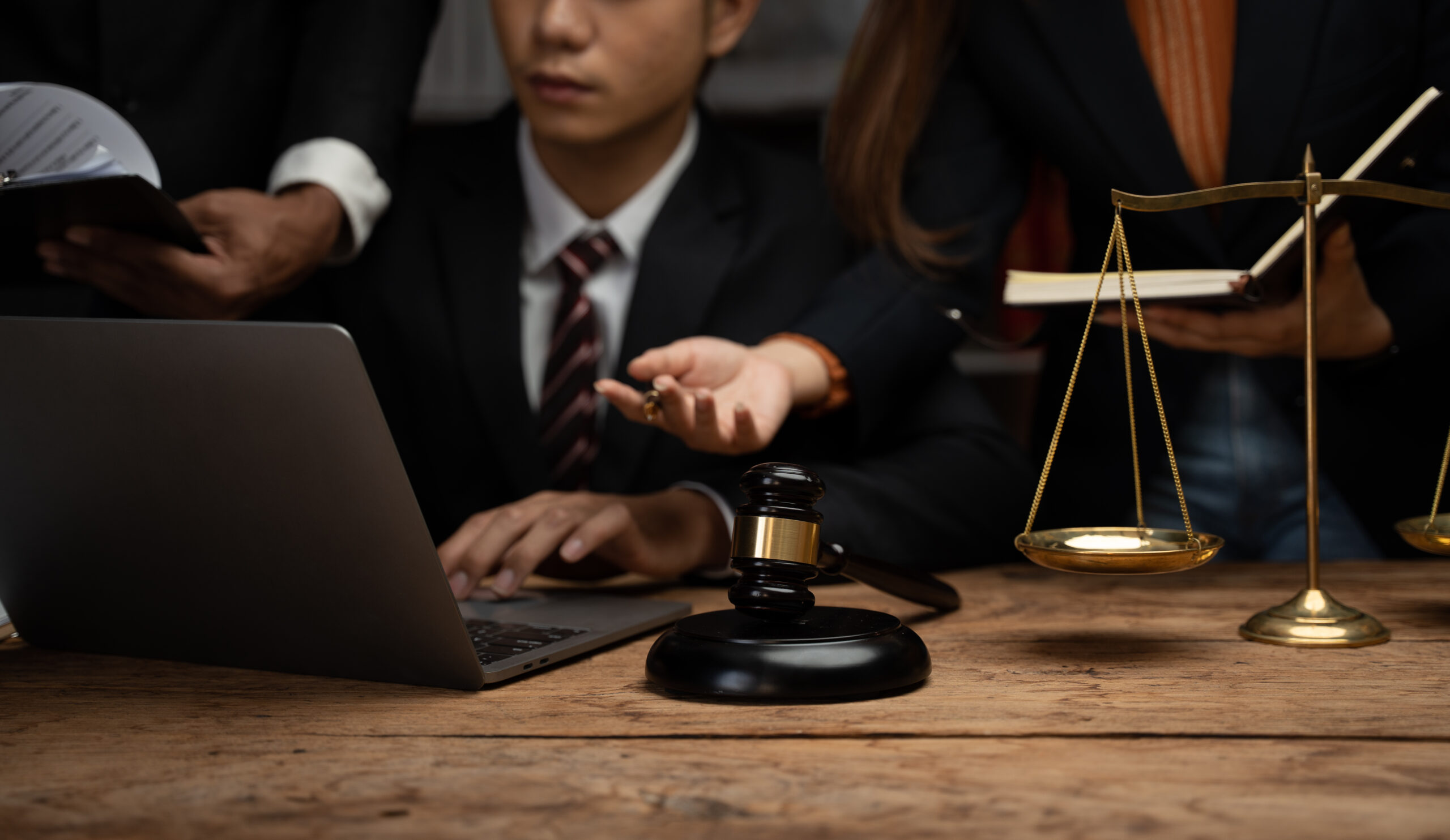 Close up lawyer businessman working or reading lawbook in office